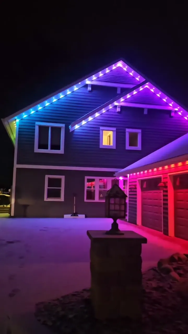 Home exterior lit with app-controlled color outdoor lighting at night in New Prague, MN Home exterior lit with app-controlled color outdoor lighting at night in New Prague, MN
